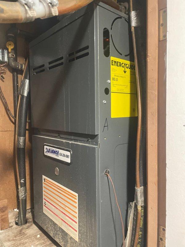 Responded to no cooling complaint on 7-year-old Alliance furnace system. Upon arrival, found Honeywell thermostat with dead batteries causing loss of communication between thermostat and HVAC system. Replaced batteries in thermostat, restoring power and proper operation. Verified thermostat display functioning correctly and system responding to temperature calls. Tested cooling cycle operation and confirmed AC unit engaging properly with adequate airflow through registers.