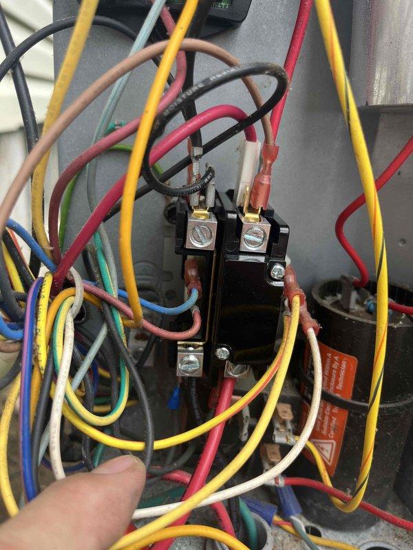 Responded to no cooling call on 10+ year old ground-level unit. Upon inspection, discovered severely corroded and burned wire connection in the electrical control panel, which was preventing the contactor from engaging properly. Cleaned and repaired the damaged wire connection, secured all loose wiring, and tested contactor operation. System restored to normal cooling operation with all electrical connections functioning safely.