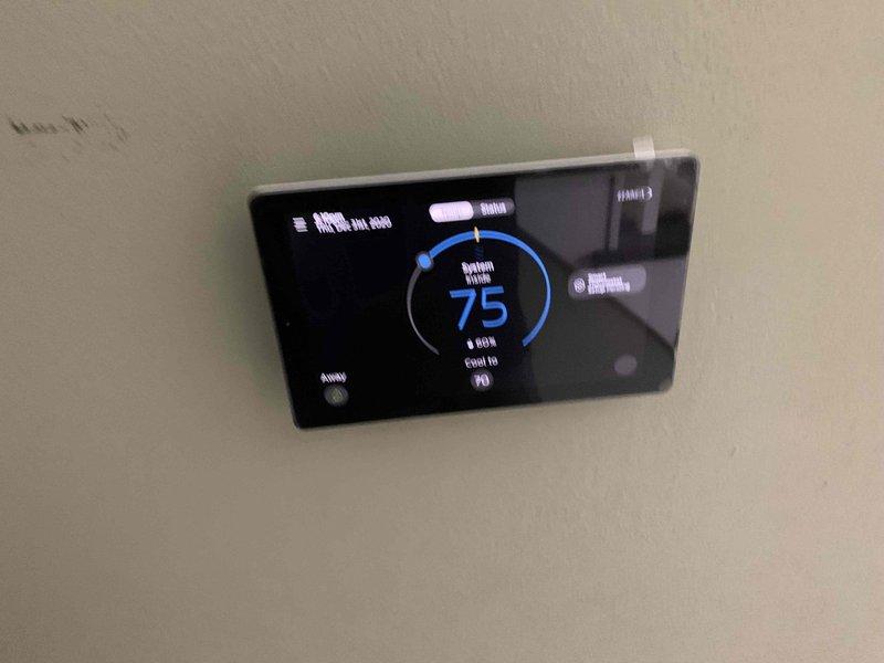 Responded to no cool call on 8-year-old residential unit located at ground level on side of home. Upon arrival, found system completely non-responsive with no cooling, no fan operation, and no thermostat activity. Inspected Everlast Infinite digital thermostat displaying 75°F with "Cool to 70" setpoint but unit failing to engage. Examined control board wiring at air handler, verifying all low-voltage connections at terminal strip including R, W, C, and communication bus terminals. Diagnosed thermostat communication failure preventing system operation. Restored proper thermostat-to-system communication, verified all wire terminations secure at control board, and tested system startup sequence. Confirmed compressor and blower motor engagement, proper airflow delivery, and cooling cycle initiation. System now operating normally with full functionality restored.
