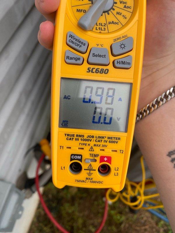 Completed comprehensive cooling system tune-up on residential air conditioning unit located in side yard. Performed diagnostic testing using digital multimeter, measuring electrical current draw at 0.98 amps and confirming voltage readings at the condenser unit, with temperature differential recorded at 420.1°F. All system parameters verified within manufacturer specifications for unit under 10 years of age, and equipment is operating efficiently for the cooling season.