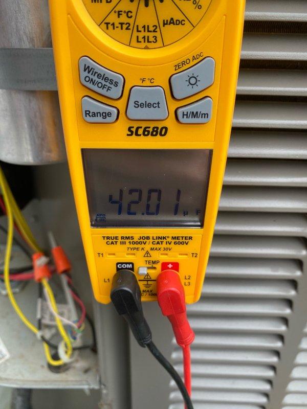 Completed comprehensive cooling system tune-up on residential air conditioning unit located in side yard. Performed diagnostic testing using digital multimeter, measuring electrical current draw at 0.98 amps and confirming voltage readings at the condenser unit, with temperature differential recorded at 420.1°F. All system parameters verified within manufacturer specifications for unit under 10 years of age, and equipment is operating efficiently for the cooling season.