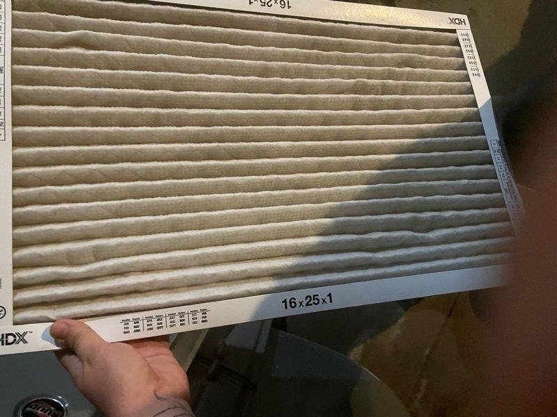 Completed comprehensive tune-up service on residential outdoor AC condenser unit located on side of property. Performed standard maintenance protocol including system inspection, cleaning, and operational testing. Replaced dirty 16x25x1 pleated air filter that showed significant dust and debris accumulation, improving airflow and system efficiency.