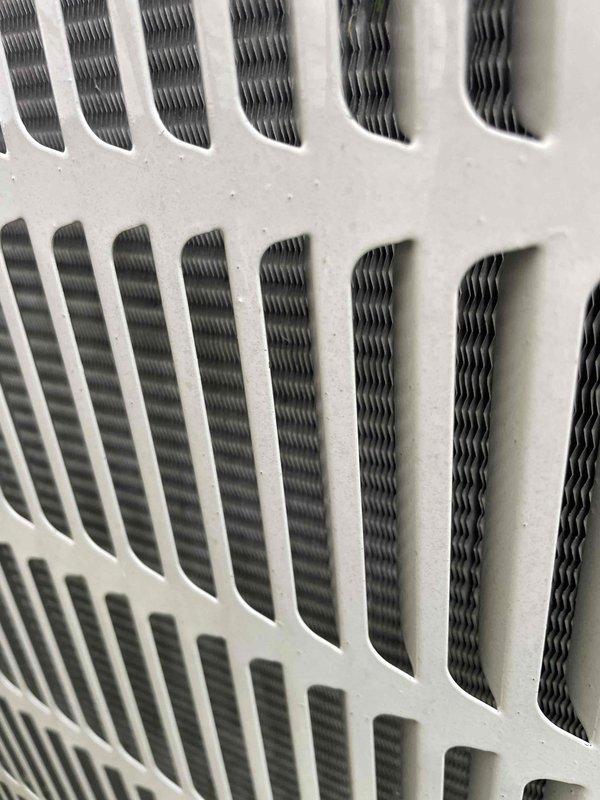 Completed preventive maintenance tune-up on single residential air conditioning unit located on side of home. Performed standard inspection of system components including air distribution diffuser and filter assembly, verified proper airflow through supply vents and return grille, and documented equipment condition through photographic documentation showing concentric ring diffuser and pleated filter media in serviceable condition.
