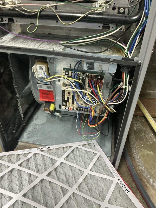 Completed comprehensive cooling system tune-up on residential air conditioning unit located at side of home. Performed full system inspection including electrical components, control board, wiring connections, and thermostat functionality. Verified proper airflow with 16x20x1 air filter in place and confirmed thermostat operation at 73°F with cooling mode engaged.