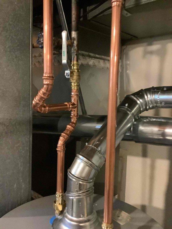 Installed a 40-gallon gas tall water heater in the mechanical utility room, including all necessary copper supply line connections with brass fittings and isolation valves. Configured the exhaust venting system with metallic ductwork and connected gas supply lines to manufacturer specifications. All plumbing connections were secured and tested to ensure proper operation and code compliance.