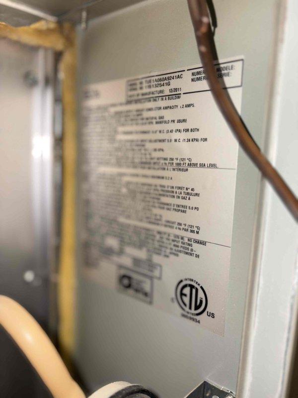 Completed comprehensive tune-up service on single outdoor air conditioning unit per Home Depot work order. Performed standard maintenance procedures including inspection of manufacturer specifications on Goodman unit model L1000A024-1AC, verified electrical connections and ampacity ratings at 12 amps, and documented control board wiring configuration with transformer and blower motor components. All systems operational upon completion with photographic documentation of equipment data plate and interior control cabinet for service records.