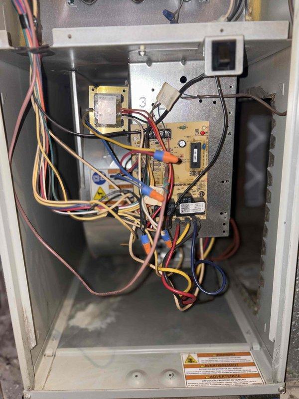 Completed comprehensive tune-up service on single outdoor air conditioning unit per Home Depot work order. Performed standard maintenance procedures including inspection of manufacturer specifications on Goodman unit model L1000A024-1AC, verified electrical connections and ampacity ratings at 12 amps, and documented control board wiring configuration with transformer and blower motor components. All systems operational upon completion with photographic documentation of equipment data plate and interior control cabinet for service records.