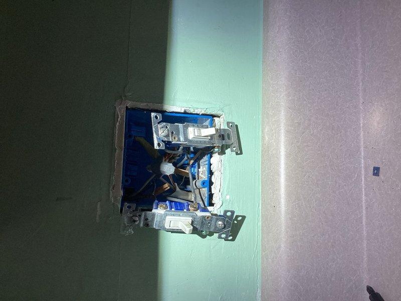 Responded to non-functional dual switch controlling kitchen garbage disposal and sink light fixture. Upon inspection, identified failed switch mechanism in dual gang box. Removed existing switch plate and tested circuits for proper voltage and continuity. Replaced defective dual toggle switch with new unit, verified proper wire connections to both disposal and light circuits, and confirmed ground connections were secure. Tested both switches for proper operation of garbage disposal and overhead sink lighting fixture. Reinstalled cover plate and restored full functionality to both kitchen electrical controls.