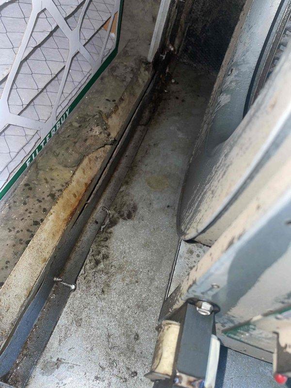 Responded to no cooling complaint on 7-year-old Lennox system with weak airflow. Upon inspection, discovered significant water damage and standing water on concrete floor near indoor air handler unit, indicating a clogged condensate drain line. Cleared drain line obstruction, verified proper drainage flow, and confirmed system returned to normal cooling operation with restored airflow.