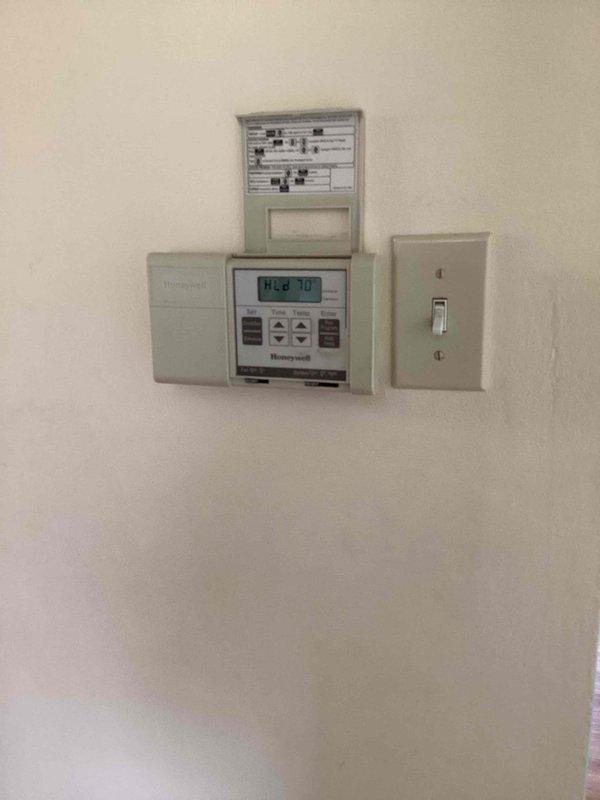 Responded to no-cool call on 26-year-old Lennox air conditioning unit. Found condensate drain line completely clogged, preventing proper drainage and causing system shutdown. Successfully cleared obstruction from drain hose using appropriate tools and verified proper water flow. Tested system operation with refrigerant manifold gauge, confirmed proper pressures and temperatures, and restored cooling function. Unit operating within normal parameters upon departure.