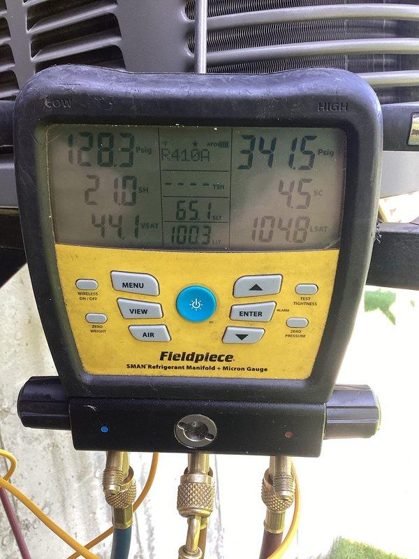 Responded to no cooling complaint on basement-located HVAC unit. Upon inspection, found failed dual run capacitor (45/5 MFD) dated 6-1-26. Verified system pressures and temperatures using refrigerant manifold gauges, confirming inadequate cooling performance due to capacitor failure. Replaced defective capacitor with OEM equivalent, restored proper electrical connections, and tested system operation. Unit now cooling properly with pressures and superheat within manufacturer specifications.