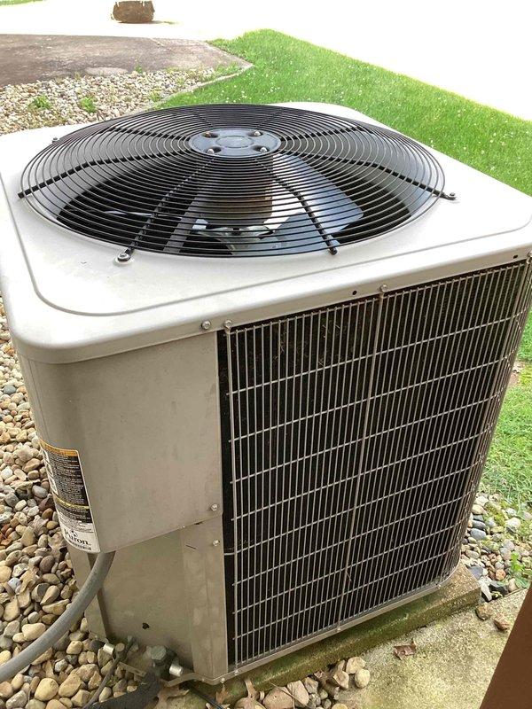Responded to report of condenser fan not operating properly on outdoor AC unit. Upon arrival, performed diagnostic inspection of 10+ year old system. Confirmed unit was still producing cooling despite fan concern. Inspected condenser unit exterior cabinet, fan grille assembly, and electrical components. Verified thermostat functionality showing system calling for cooling at 82°F. Completed necessary repairs to restore proper fan operation and confirmed system cycling correctly with adequate airflow through condenser coil.