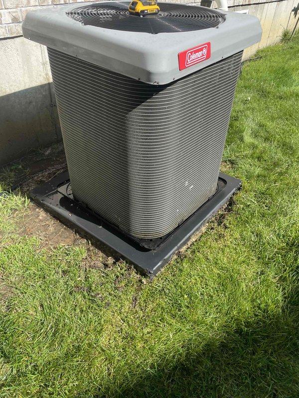 # HVAC Cooling System Tune-Up Completed

Performed comprehensive preventive maintenance tune-up on a 6-year-old Coleman residential air conditioning system. Service included inspection and maintenance of both indoor air handler unit located in basement and outdoor condenser unit. 

## Indoor Air Handler Service

Accessed evaporator coil assembly through ceiling-mounted air handler. Inspected blower wheel assembly and verified proper operation of fan motor. Examined electrical connections and wiring harness for secure terminations and proper voltage. Noted existing water staining on surrounding ceiling surfaces indicating previous moisture concerns, though no active leakage was observed during service visit. Verified condensate drain system functionality to prevent future water damage.

## Outdoor Condenser Service

Inspected Coleman condenser unit positioned on composite base pad. Verified unit levelness and proper clearances from structure. Examined condenser coil fins for debris accu