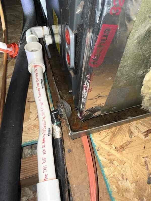 Responded to no cooling complaint caused by clogged condensate drain line with water overflow from secondary drain. Previous technician had cleared both primary and secondary drains; returned to complete permanent repair of exterior drain line. Installed 3/4-inch PVC coupling to repair damaged section of condensate drain piping on exterior wall. Verified primary and secondary drain lines flowing freely with no restrictions. Inspected air filter condition and confirmed proper system operation with adequate cooling performance restored.