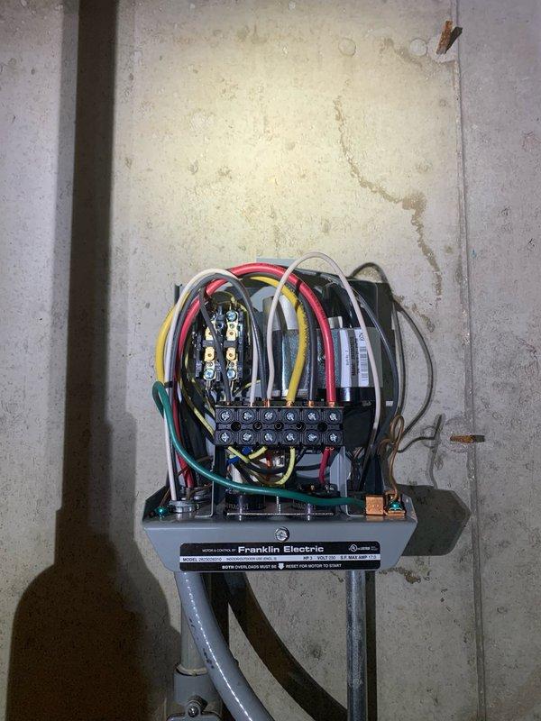 Responded to service call for well pump control box failing to maintain pump operation. Inspected Franklin Electric control panel and associated wiring connections in basement mechanical space. Found loose terminal connections on contactor assembly causing intermittent power delivery to pump motor. Tightened all terminal screws on brass contact points, verified proper wire seating on terminal block, and tested capacitor connections. Cycled pump through multiple on/off sequences to confirm reliable operation and sustained power delivery through control box circuitry.