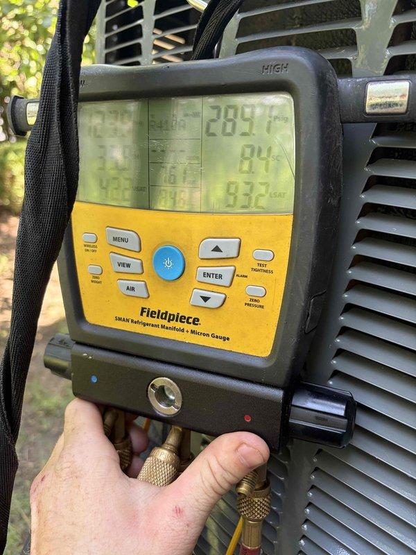 Responded to no cooling call on 2001 Lennox air conditioning system. Upon arrival, performed diagnostic testing using digital manifold gauges and clamp meter to assess system performance. Measured refrigerant pressures showing 289 PSIG on high side and 93.2 PSIG on low side, along with electrical readings of 90.5 amps, indicating potential compressor or refrigerant charge issues requiring further evaluation and repair.
