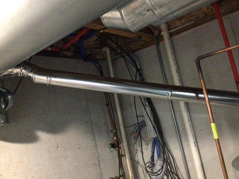 Installed a 40-gallon gas tall water heater in basement mechanical room, including all necessary copper supply line connections, PVC exhaust venting, and gas line hookup. Unit was properly positioned and secured with all connections tested for leaks and proper operation. Installation completed under permit RAL26-0000950 in compliance with local code requirements.