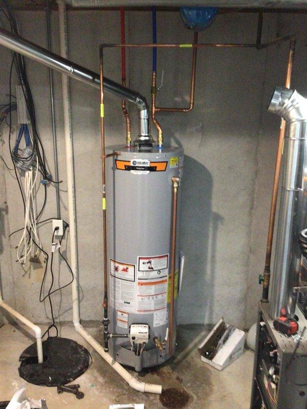 Installed a 40-gallon gas tall water heater in basement mechanical room, including all necessary copper supply line connections, PVC exhaust venting, and gas line hookup. Unit was properly positioned and secured with all connections tested for leaks and proper operation. Installation completed under permit RAL26-0000950 in compliance with local code requirements.