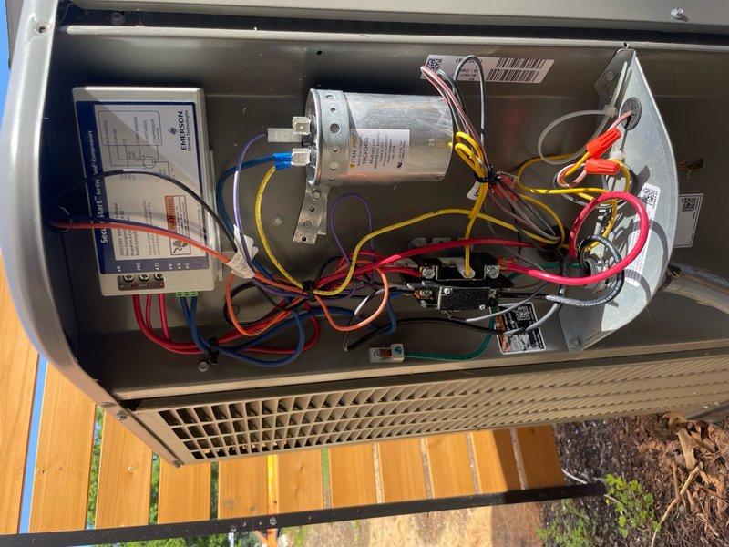 Installed soft start kit on HVAC unit to reduce compressor startup current and improve system efficiency. Replaced failed capacitor under warranty with van stock unit, ensuring proper electrical connections and secure mounting within the equipment cabinet. System tested and verified operational for both heating and cooling modes upon completion.