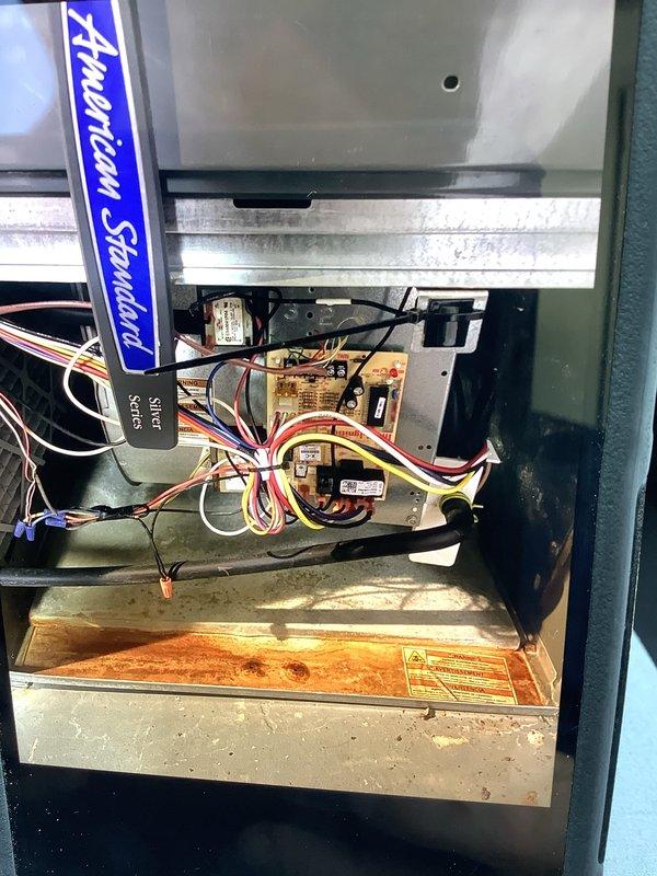 Performed preventive seasonal cooling check on a 13-year-old American Standard air conditioning system. Inspected interior components of air handler unit, verifying electrical connections, control boards, and wiring harness integrity. Evaluated 20x25x1 air filter condition and replaced with new filter to ensure proper airflow and system efficiency. All electrical components, circuit boards, and connections found in satisfactory operating condition with no immediate concerns noted.