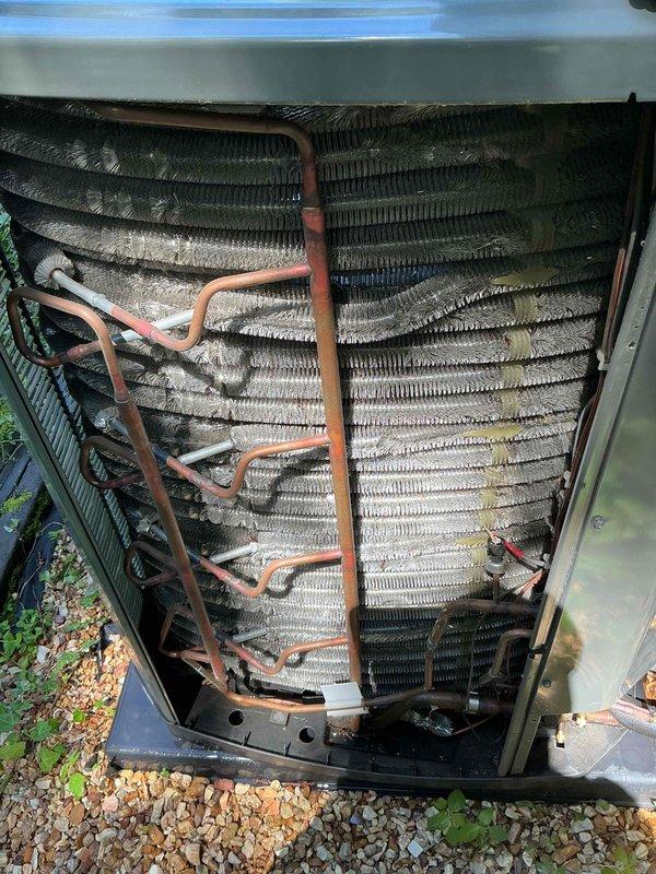 Completed scheduled cooling maintenance on 2-year-old Trane system. Performed comprehensive AC tune-up including inspection of condenser coil, which showed moderate dirt and debris accumulation on fin surfaces, and refrigerant line set evaluation. Customer reported slight pinging noise in refrigerant lines during operation; inspected copper refrigerant lines and connections for potential vibration points or loose mounting. Verified system operational status and all components functioning properly.