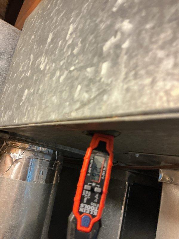 Provided temporary cooling solution for client requiring 410A refrigerant system. Performed diagnostic measurements at ceiling return air vent to assess airflow and temperature conditions, then accessed HVAC equipment in attic space to complete necessary service work and ensure proper system operation.