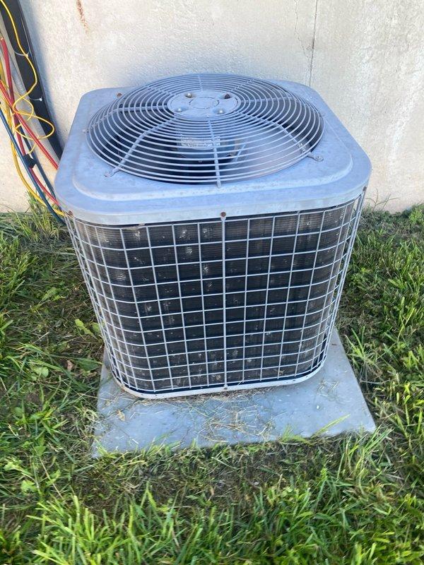 Completed comprehensive cooling system tune-up on 10-year-old residential AC unit, including refrigerant pressure analysis using digital manifold gauge showing operating pressures and system diagnostics. Performed condenser coil fin combing to restore airflow efficiency on outdoor unit, inspected fan operation and overall system components, and documented equipment condition with diagnostic readings for customer records.