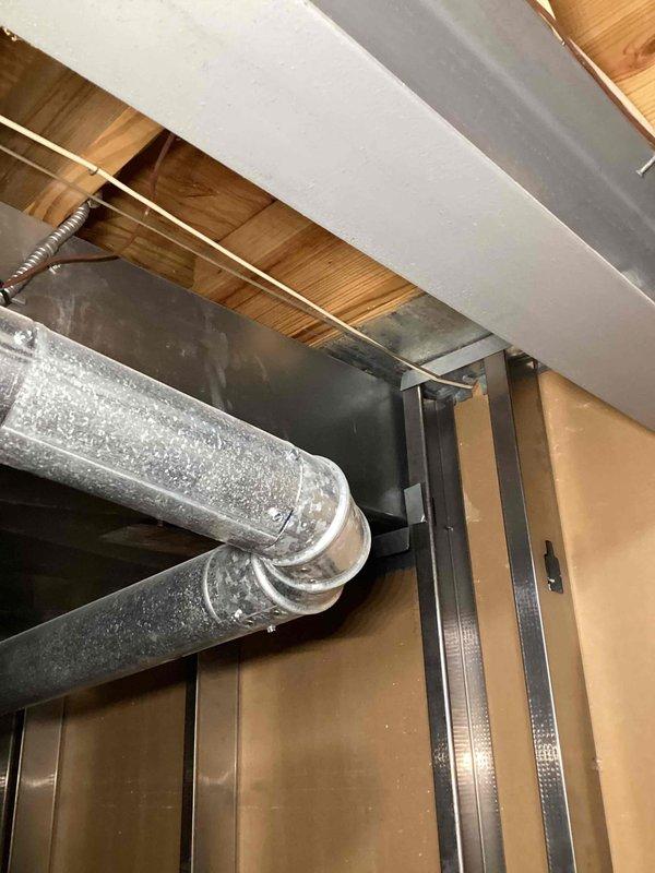Responded to complaint of upstairs area consistently overheating. Performed comprehensive indoor air quality assessment and inspected 15-year-old HVAC system ductwork in attic space. Identified inadequate insulation on supply ductwork with visible condensation, improperly sized or blocked ducts restricting airflow to second floor, and potential air balance issues affecting temperature distribution. Documented existing duct configuration, insulation deficiencies, and structural mounting conditions. Provided recommendations for ductwork insulation upgrades, airflow balancing, and potential zoning solutions to resolve hot spot concerns in upper level living spaces.