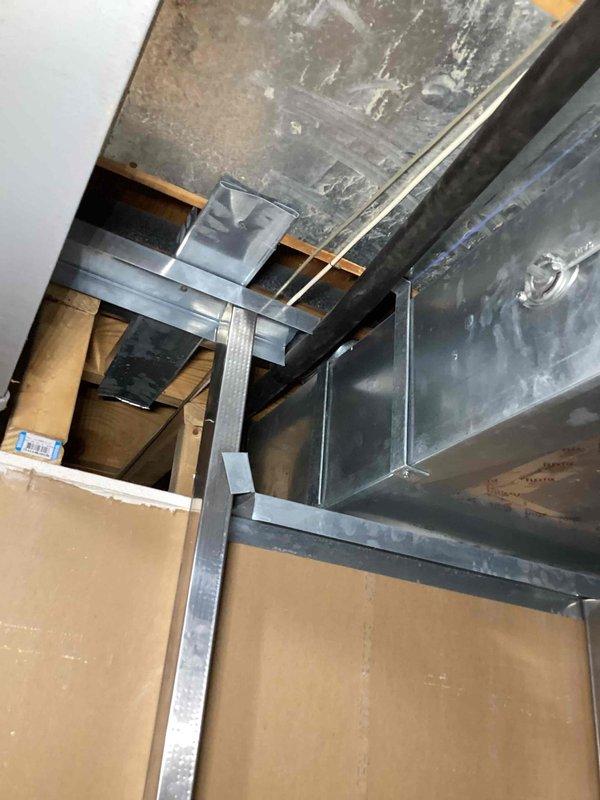 Responded to complaint of upstairs area consistently overheating. Performed comprehensive indoor air quality assessment and inspected 15-year-old HVAC system ductwork in attic space. Identified inadequate insulation on supply ductwork with visible condensation, improperly sized or blocked ducts restricting airflow to second floor, and potential air balance issues affecting temperature distribution. Documented existing duct configuration, insulation deficiencies, and structural mounting conditions. Provided recommendations for ductwork insulation upgrades, airflow balancing, and potential zoning solutions to resolve hot spot concerns in upper level living spaces.