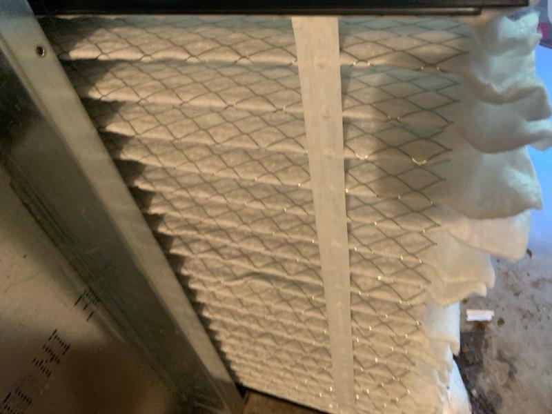 Completed comprehensive tune-up on a 2-year-old residential air conditioning unit located in the backyard. System inspection revealed heavily soiled condenser coils with significant accumulation of dirt, dust, and debris throughout the heat exchanger fins, which was thoroughly cleaned to restore optimal heat transfer efficiency. Replaced dirty air filter with fresh media to ensure proper airflow and system performance.