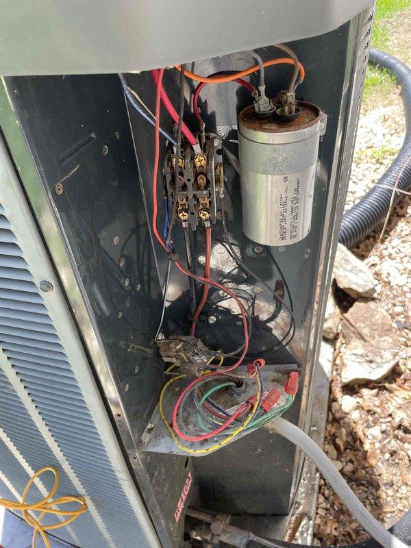 Completed comprehensive cooling system tune-up on outdoor AC unit located in backyard. Upon inspection, condenser coils showed heavy accumulation of dirt, dust, and debris throughout both coil banks, significantly restricting airflow and reducing system efficiency. Performed thorough coil cleaning to restore proper heat transfer capability. Inspected electrical components including capacitor and contactor, verified all wire connections were secure, and confirmed system operational status. Unit returned to proper working condition with improved airflow and cooling performance.