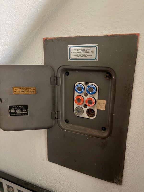 Responded to power outage affecting approximately one-third of the electrical circuits. Upon inspection of the Killark fuse panel, identified and replaced a failed fuse; however, the replacement fuse immediately blew upon restoration of power, indicating an underlying short circuit or overload condition in the protected circuit. Documented existing electrical infrastructure, including the aging fuse panel installation and associated wiring. Advised that specialized circuit tracing equipment is required to isolate the fault location within the affected branch circuit before permanent repairs can be completed.