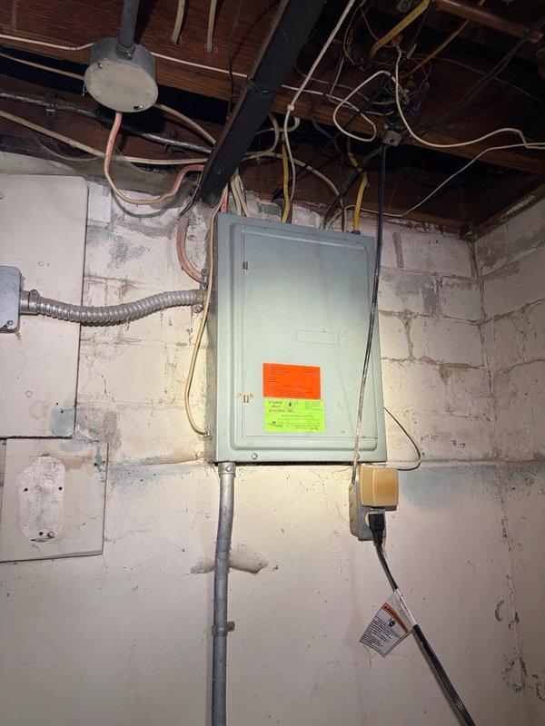 Responded to power outage affecting approximately one-third of the electrical circuits. Upon inspection of the Killark fuse panel, identified and replaced a failed fuse; however, the replacement fuse immediately blew upon restoration of power, indicating an underlying short circuit or overload condition in the protected circuit. Documented existing electrical infrastructure, including the aging fuse panel installation and associated wiring. Advised that specialized circuit tracing equipment is required to isolate the fault location within the affected branch circuit before permanent repairs can be completed.