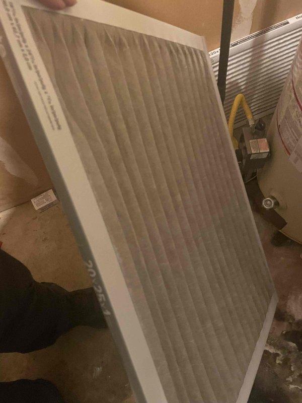 Completed cooling system tune-up on 13-year-old outdoor AC unit. Inspected and replaced dirty air filter, cleaned condenser coil fins which had accumulated significant debris and organic material between the fins affecting heat transfer efficiency. System operational upon completion of preventative maintenance service.