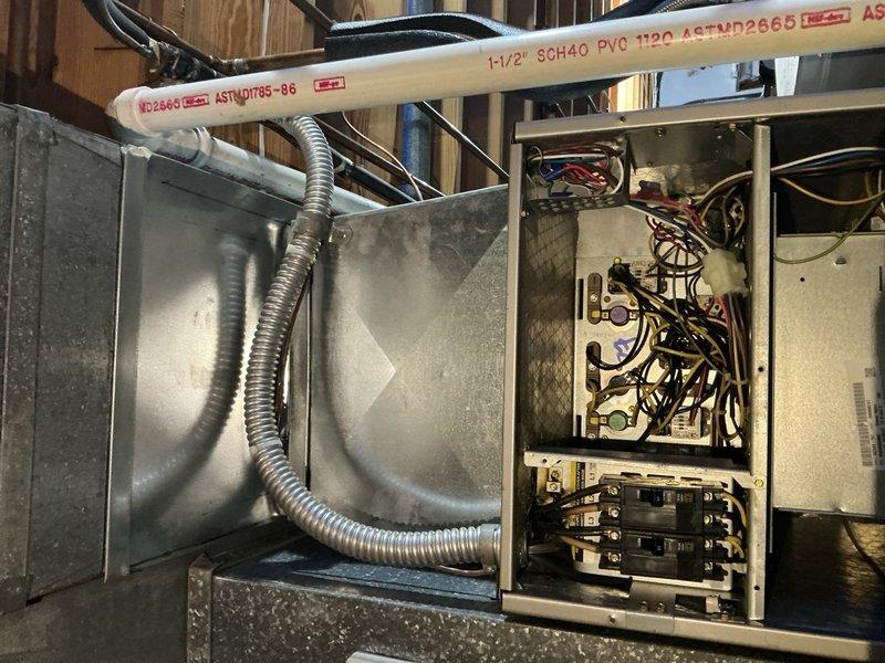 Conducted comprehensive electrical estimate for HVAC system wiring in basement utility area. Assessed existing electrical panel configuration with complex multi-conductor wiring connections to air handler unit, evaluated metallic flexible conduit routing between equipment and control panel, and documented current installation including PVC conduit runs and circuit breaker arrangement. Provided detailed wiring recommendations for system integration and code compliance requirements.