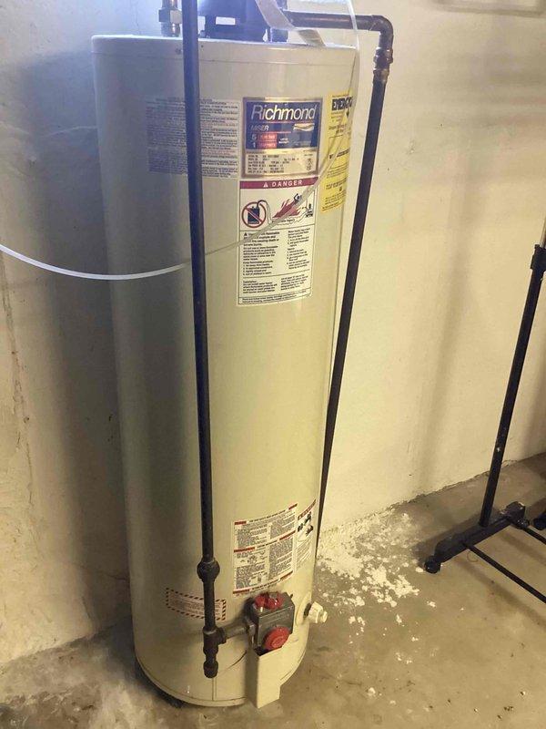 Responded to service call for air conditioning unit struggling to maintain temperature with water leakage in basement. Upon inspection, found outdoor condensing unit operational but system experiencing drainage issues causing water accumulation in basement near water heater. Assessed evaporator coil drain line for blockages and verified proper condensate removal. Identified compromised drainage system as primary cause of water intrusion. Cleared condensate line obstruction and confirmed proper water flow away from living space. Verified system cooling capacity restored to normal operation and educated customer on proper maintenance to prevent future drainage issues.
