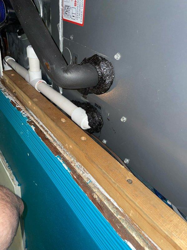 Responded to no-cool call on residential air conditioning unit less than 10 years old located in side yard. Upon arrival, confirmed customer report of warm air from supply registers and observed frozen evaporator coil. Advised customer to turn unit off at thermostat and set fan to continuous operation to facilitate ice melting. Inspected refrigerant lines, condensate drain system, and equipment mounting components. Documented existing installation configuration including suction and liquid line routing, condensate drain piping, and equipment pad condition. Unit requires follow-up visit after coil has fully thawed to diagnose root cause of freezing condition, which may include restricted airflow due to dirty filter or blocked return, low refrigerant charge from potential leak, failed blower motor or capacitor, or malfunctioning metering device. Customer instructed to monitor system and schedule diagnostic appointment once ice has completely melted.