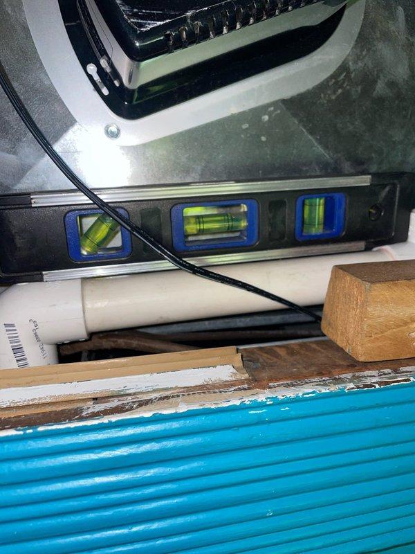 Responded to no-cool call on residential air conditioning unit less than 10 years old located in side yard. Upon arrival, confirmed customer report of warm air from supply registers and observed frozen evaporator coil. Advised customer to turn unit off at thermostat and set fan to continuous operation to facilitate ice melting. Inspected refrigerant lines, condensate drain system, and equipment mounting components. Documented existing installation configuration including suction and liquid line routing, condensate drain piping, and equipment pad condition. Unit requires follow-up visit after coil has fully thawed to diagnose root cause of freezing condition, which may include restricted airflow due to dirty filter or blocked return, low refrigerant charge from potential leak, failed blower motor or capacitor, or malfunctioning metering device. Customer instructed to monitor system and schedule diagnostic appointment once ice has completely melted.