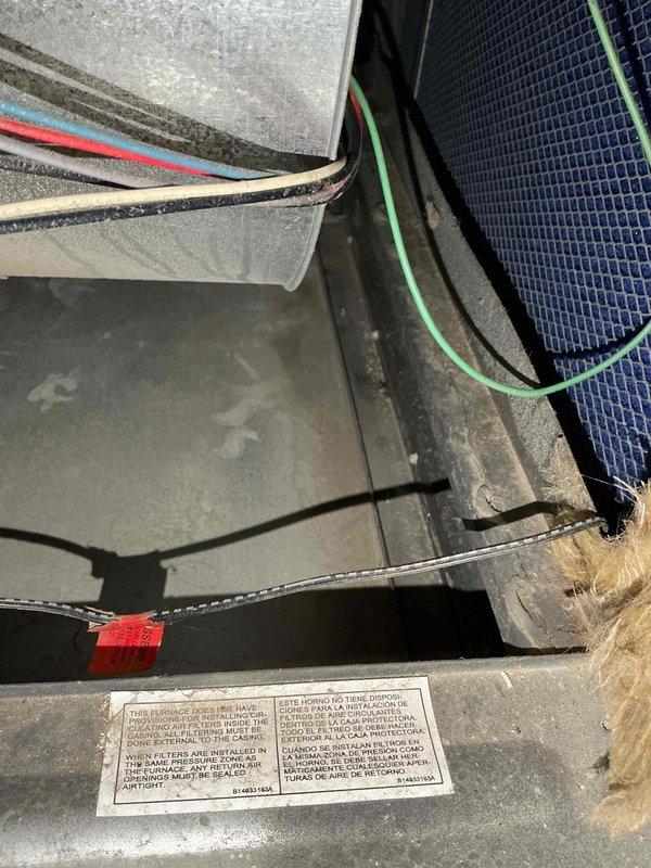 Performed comprehensive furnace inspection on 10-year-old Goodman GMVC80805CN unit located in basement following reported concerns about previous leak affecting system operation. Accessed blower compartment and control board assembly, visually inspected all electrical connections, wiring harnesses, and control boards for signs of water damage or corrosion. Examined condensate drain line and flexible drain hose for proper routing and functionality. Verified all safety labels present and legible, confirmed air filter condition, and inspected ductwork connections for integrity. All components found to be functioning properly with no evidence of leak-related damage to electrical systems or controls.