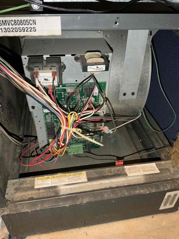 Performed comprehensive furnace inspection on 10-year-old Goodman GMVC80805CN unit located in basement following reported concerns about previous leak affecting system operation. Accessed blower compartment and control board assembly, visually inspected all electrical connections, wiring harnesses, and control boards for signs of water damage or corrosion. Examined condensate drain line and flexible drain hose for proper routing and functionality. Verified all safety labels present and legible, confirmed air filter condition, and inspected ductwork connections for integrity. All components found to be functioning properly with no evidence of leak-related damage to electrical systems or controls.