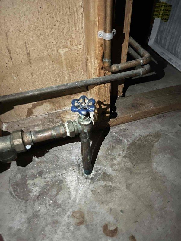 Returned to property to replace exterior hose bib as previously estimated. Successfully removed old brass hose bib from exterior wall and installed new unit, ensuring proper seal against vinyl siding to prevent water intrusion. While on site, also addressed reported clogged drain issue in basement by inspecting the drainage system and plumbing fixtures. Verified proper operation of all valves and connections in basement plumbing system, including blue-handled shutoff valve and associated piping mounted on wooden support beam. All work completed successfully with systems tested and functioning properly.