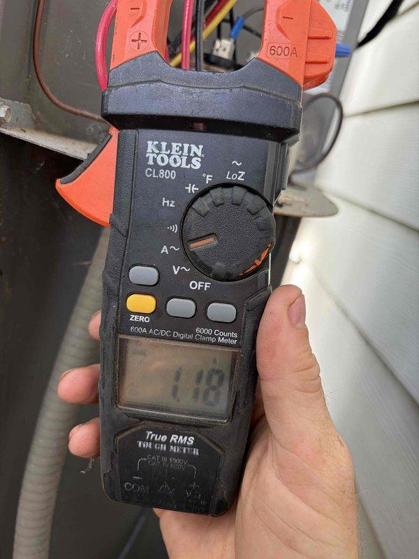 Completed preventive maintenance tune-up on two cooling systems. Performed comprehensive inspections including electrical measurements with digital clamp meter to verify proper amperage draw and system performance. Inspected air filtration components, noting accumulated dust and debris on mesh filter requiring attention. Both systems operational and running within normal parameters upon completion of maintenance procedures.