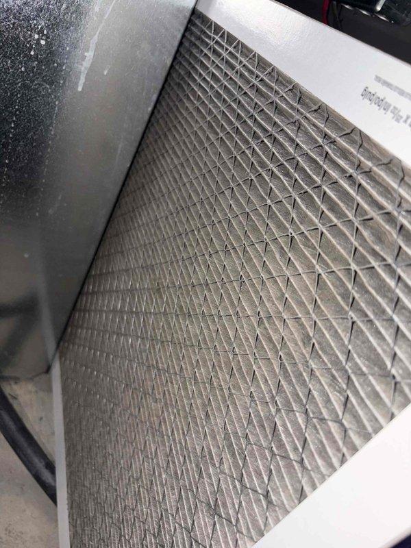 Completed preventive maintenance tune-up on two cooling systems. Performed comprehensive inspections including electrical measurements with digital clamp meter to verify proper amperage draw and system performance. Inspected air filtration components, noting accumulated dust and debris on mesh filter requiring attention. Both systems operational and running within normal parameters upon completion of maintenance procedures.