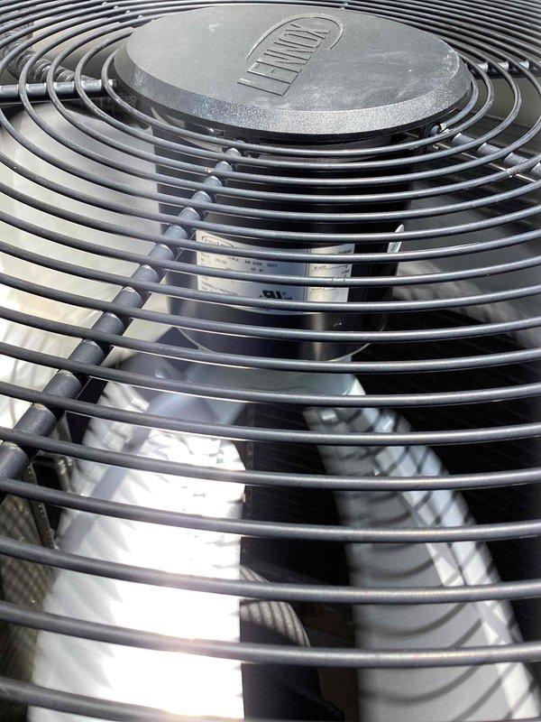 Replaced defective condenser fan motor and fan blade on outdoor HVAC unit. Unit was tested after repair and confirmed operational for both heating and cooling functions. Old components were removed and discarded per warranty protocol.