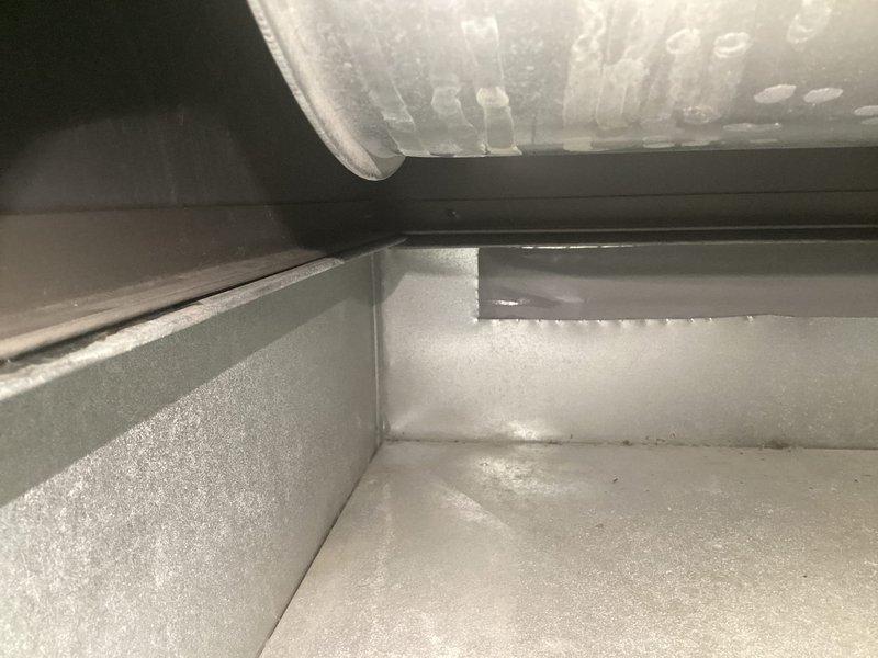 Responded to recall for 8-month-old AC unit experiencing recurring freeze-up issues after previous repair attempt. Upon arrival, inspected evaporator coil and refrigerant lines, measuring supply air temperature at 38°F. Evaluated airflow through ductwork system and flexible duct connections to identify restrictions or inadequate return air causing coil icing. Addressed underlying airflow deficiency and verified proper system operation before departure.