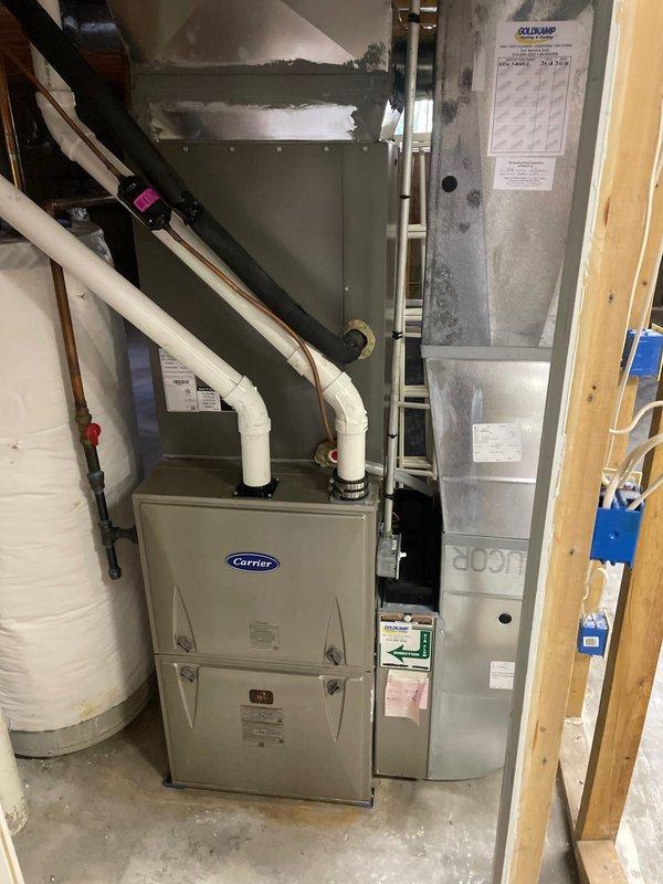 Completed comprehensive cooling system tune-up on single Carrier HVAC unit located at side of home. Performed standard maintenance protocol including inspection of control boards, electrical connections, and all system components. Verified proper operation of furnace and air handler assembly, checked refrigerant lines, condensate drainage system with PVC piping and shut-off valves, and confirmed all wiring connections were secure and functioning correctly.