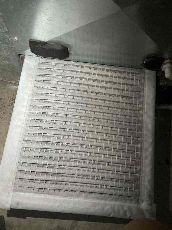 Completed preventive maintenance tune-up on single outdoor AC condenser unit. Performed comprehensive inspection of heat exchanger/evaporator coil, verified refrigerant levels, cleaned condenser coils showing moderate dirt accumulation and weathering, checked electrical connections, and tested system operation. Unit operational with wireless monitoring sensors in place; documented existing wear and surface discoloration consistent with age and outdoor exposure.