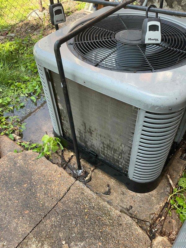 Completed preventive maintenance tune-up on single outdoor AC condenser unit. Performed comprehensive inspection of heat exchanger/evaporator coil, verified refrigerant levels, cleaned condenser coils showing moderate dirt accumulation and weathering, checked electrical connections, and tested system operation. Unit operational with wireless monitoring sensors in place; documented existing wear and surface discoloration consistent with age and outdoor exposure.