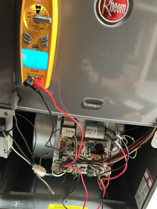 # HVAC Tune-Up Completed

Performed comprehensive preventive maintenance tune-up on Rheem air conditioning unit located at front of property per Home Depot work order F59860966. Conducted electrical diagnostics using digital multimeter to verify voltage readings (5.02V measured) on control board, capacitor, and wiring harness connections. Inspected blower wheel assembly and squirrel cage fan for debris accumulation and proper operation. All electrical components, including relays, capacitors, and wire connections, were tested and found functioning within normal parameters. Unit operational and ready for cooling season.