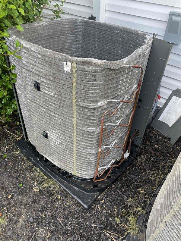 Completed comprehensive cooling system tune-up and inspection on two U10 air conditioning units located in attic and basement. Performed standard maintenance protocol including coil cleaning on outdoor condenser unit, which showed significant dirt and debris accumulation between fins, inspection of refrigerant lines noting oxidation on copper piping, and evaluation of blower wheel assembly and air handler components. Both systems were serviced during early morning appointment, with photographic documentation captured of equipment condition and completed work.